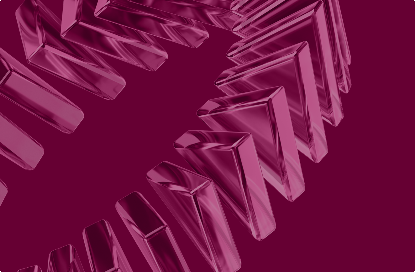 Close-up of a transparent pink glass gear with sharp triangular teeth against a solid dark magenta background.